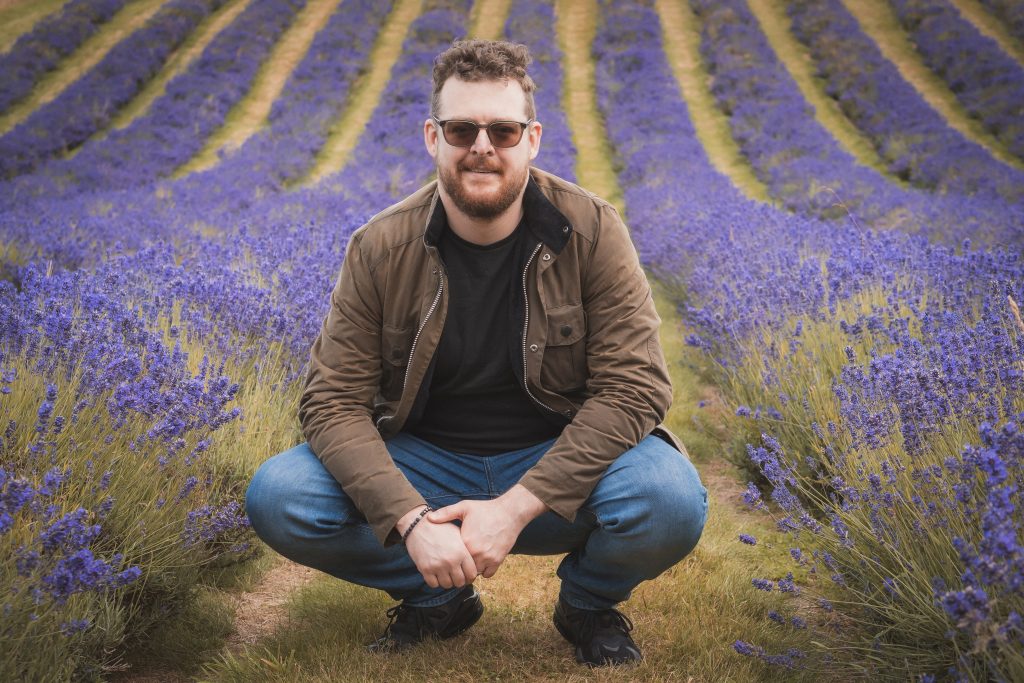 Jack McCourt, wedding photographer, in a field of lavender