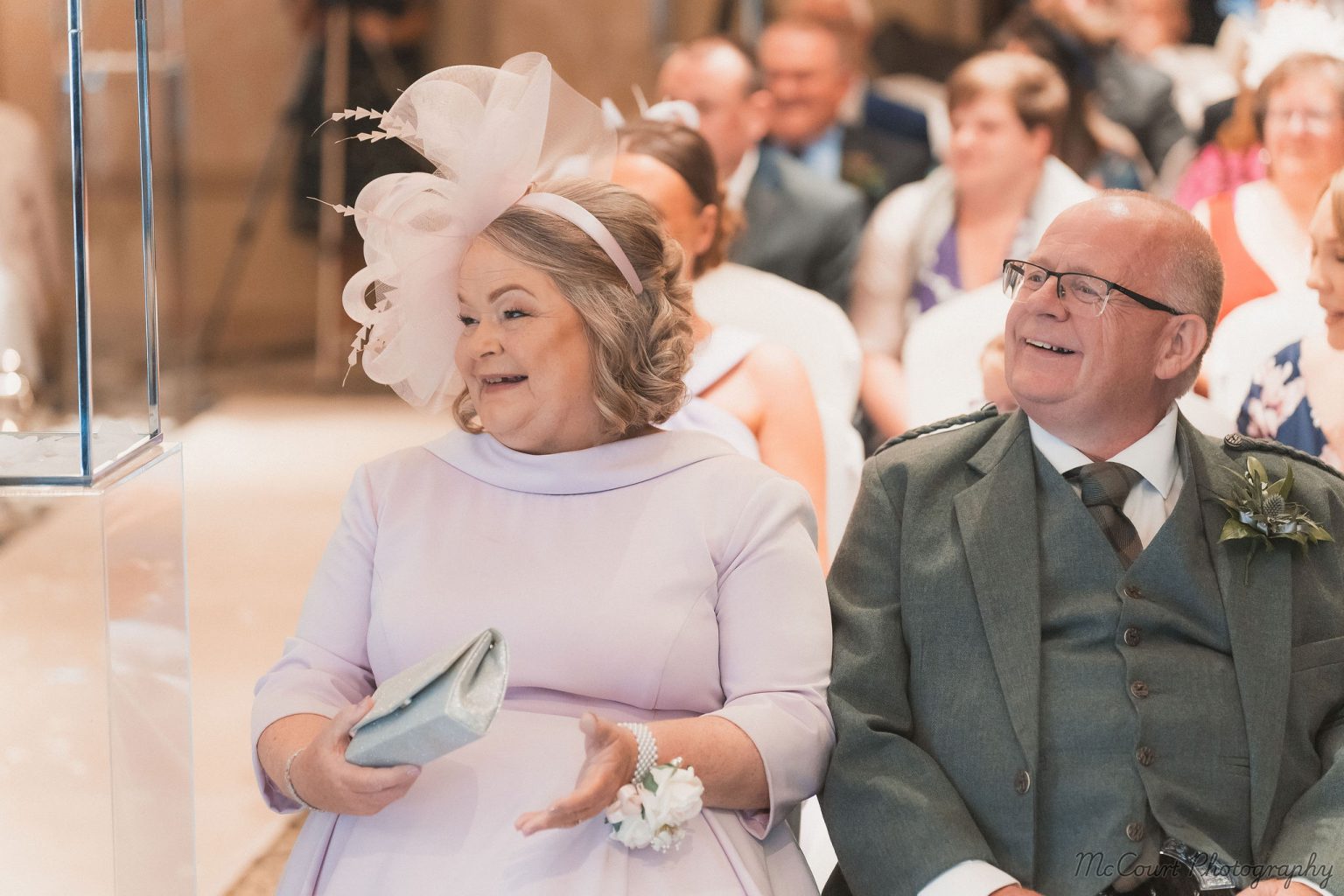 Mother and father of the bride watching their daughter get married at the dalziel park hotel