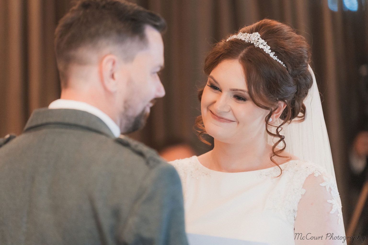 Bride smiling at her soon to be husband at the dalziel park hotel