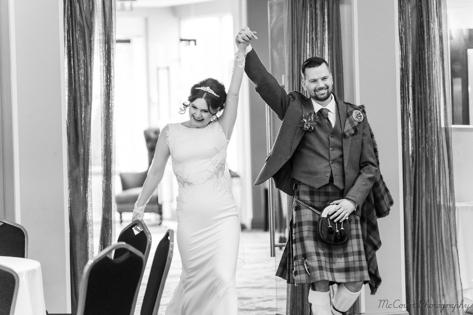 Sarah and Patrick celebrating being newly married at dalziel park hotel